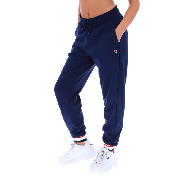 Woman wears Fila Vintage Women's Jianna Cuffed Joggers in Navy FW25WC014 410