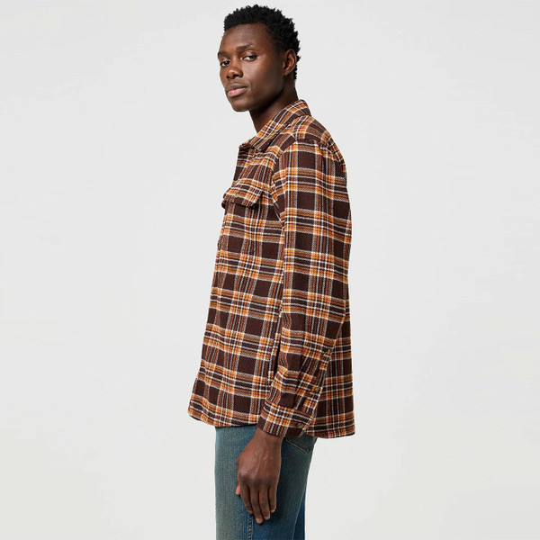 Picture of model wearing the Wrangler Retro 1970s Brushed Plaid Check Shirt in Deep Brown taken from side