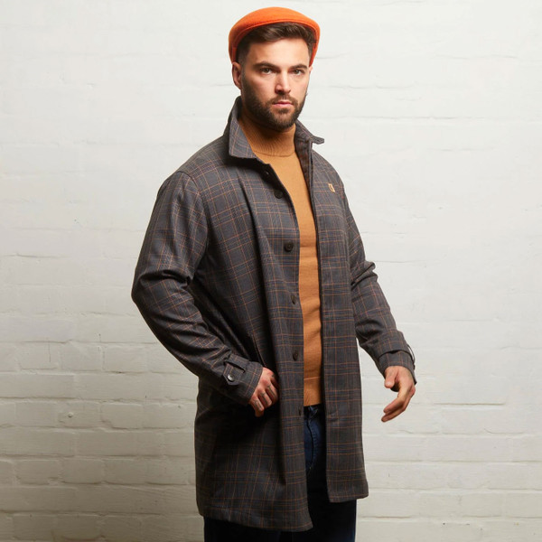 Man wears Gabicci Vintage Houghton Check Mod Men's Raincoat Mac Jacket in Charcoal V55GJ12