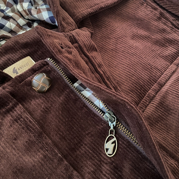 Close up on zipper and fabric on the Gabicci Vintage Chuck Retro 70s Men's Cord Duffle Coat in Clove Brown