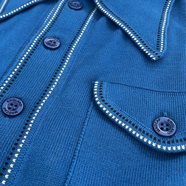 Pocket detail on the Madcap England Crawdaddy Mod Big Collar Button Through Polo Shirt in Deja Vu Blue