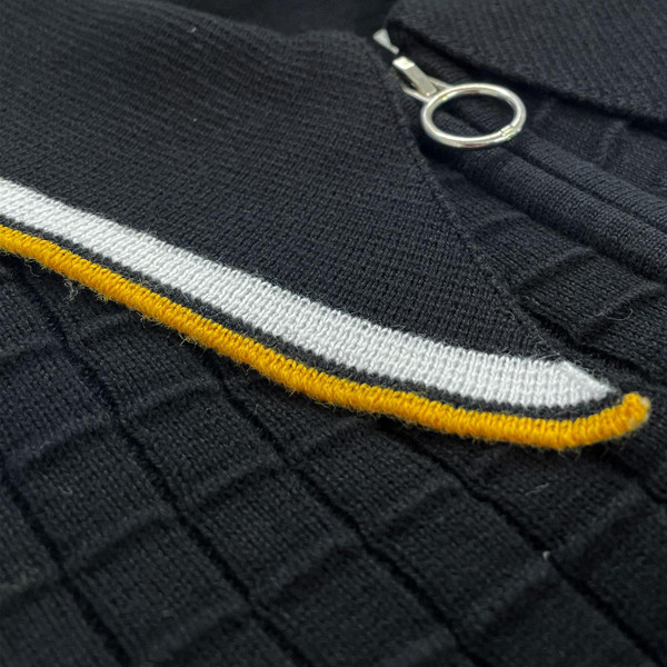 Madcap England Apollo Men's Mod Grid Knit Big Collar Tipped Polo Cardigan in Black Close Up On Tipped Collar Madcap England Apollo Men's Mod Grid Knit Big Collar Tipped Polo Cardigan in Black Close Up On Tipped Collar