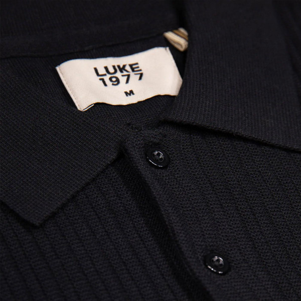Luke Dawlish Men's Retro Ribbed Knitted Stripe Sleeve Polo Shirt in Black Close up on collar