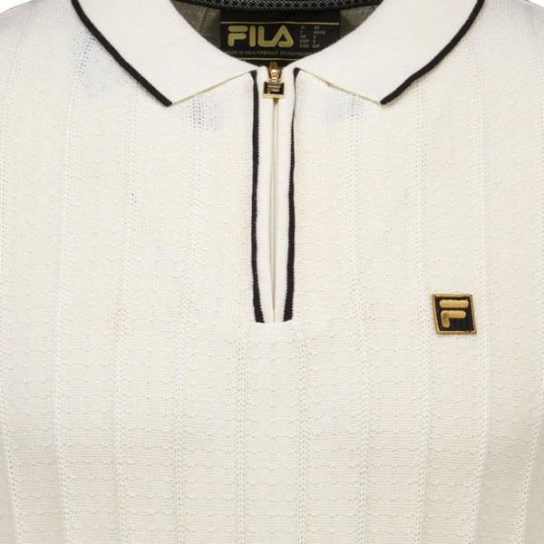 Fila Gold Sully Retro Drop Needle Zip Neck Knitted Zip Neck Polo Shirt in Tofu close up on fabric