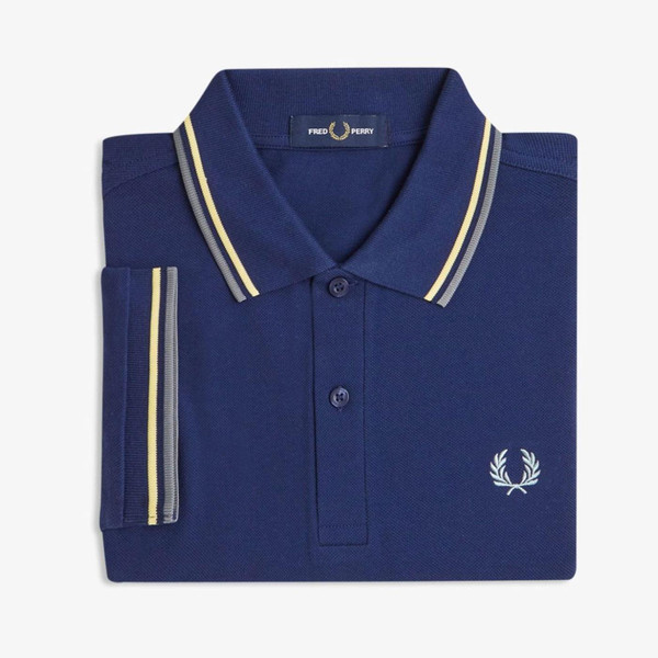Fred Perry M3600 Twin Tipped Polo Shirt in French Navy, Gold And Blue pictured folded