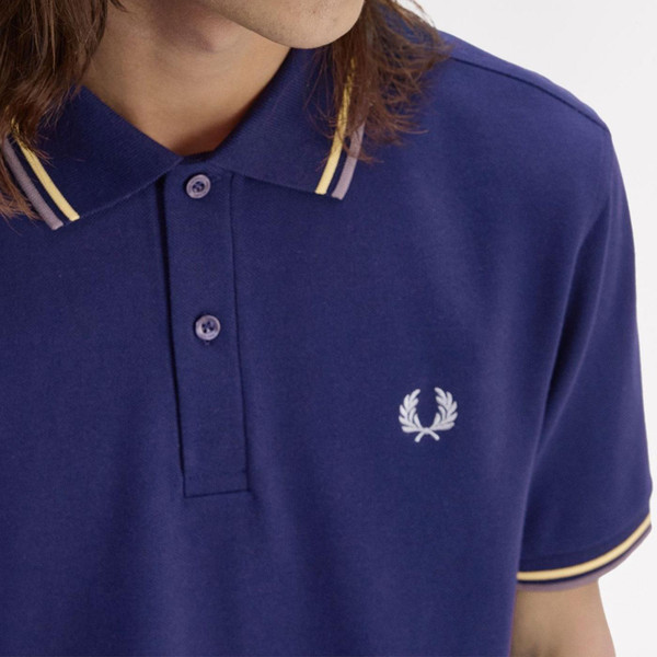 Fred Perry M3600 Twin Tipped Polo Shirt in French Navy, Gold And Blue close up on collar