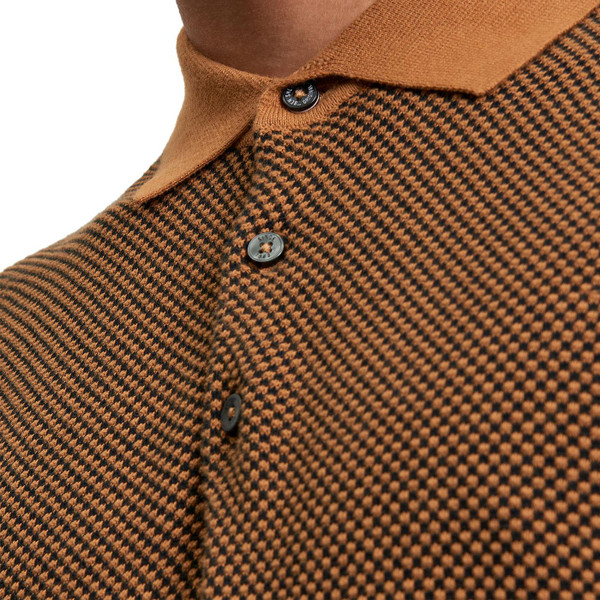 Ben Sherman Men's Retro Two Tone Textured Knit Polo Shirt in Camel close up on fabric