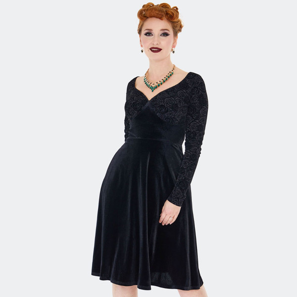 Vintage style black velvet dress with long sleeves and full skirt
