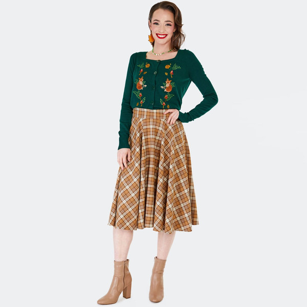 Woman wears Voodoo Vixen Women's Retro 50s Embroidered Fox & Toadstool Cardigan in Green