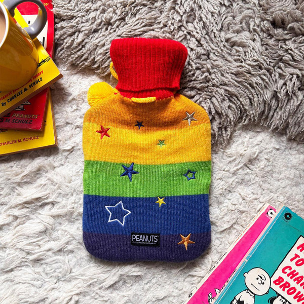 Peanuts Snoopy Rainbow Stripe Hot Water Bottle by House of Disaster - Retro Homeware - Back View Laid On Rug