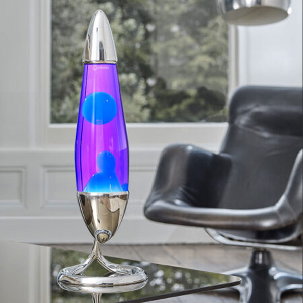 Mathmos Neo Table Lamp in Silver with Violet and Turquoise on Retro Coffee Table Beside Retro Chair
