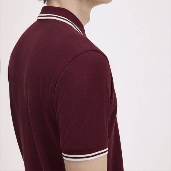 Shoulder and sleeve of Fred Perry Men's Twin Tipped Mod Polo Shirt in Oxblood Red