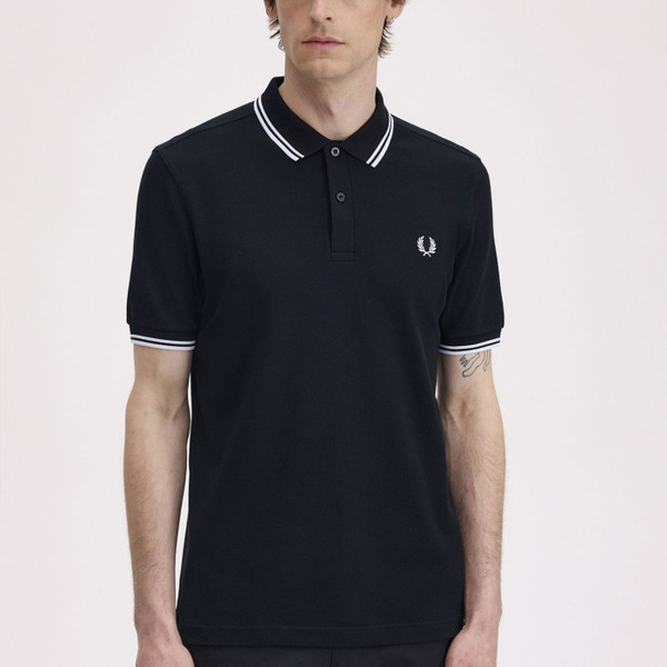 Model wears Fred Perry Men's Twin Tipped Polo Shirt in Black
