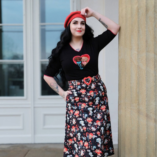 Lifestyle photo of  Voodoo Vixen Puppy Love Valentines Retro Knit Jumper in Black/Red by vintage pillars
