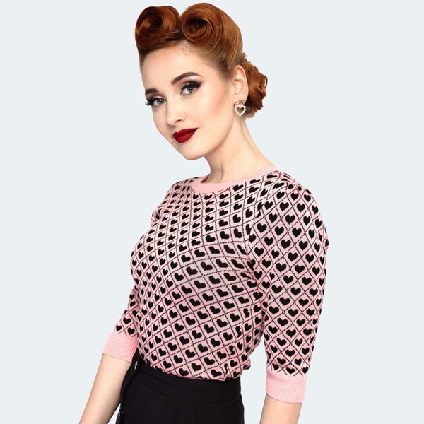 Women wears Voodoo Vixen Retro 50s Geometric Heart Pattern 50s Sweater in Pink