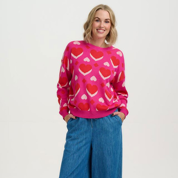 Woman wears Sugarhill Brighton Andi Pink Hearts Valentines Jumper K0957