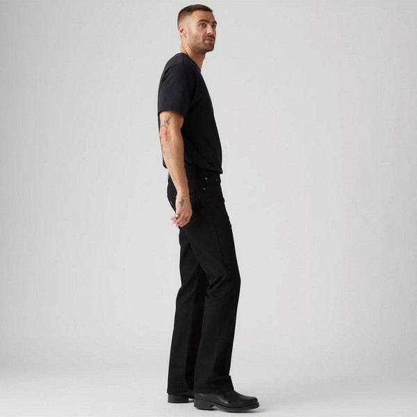 Model Wearing Levi's 527 Slim Bootcut Men's Denim Jeans in Native Cali Black 055270539 - Side View
