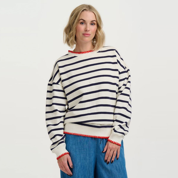 Woman wears Sugarhill Brighton Eadie Relaxed Fit Sweatshirt in Off White/Navy Stripes
