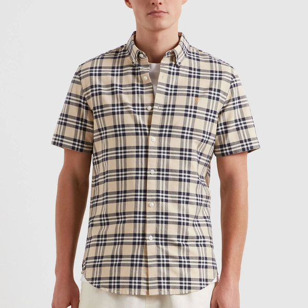 Man wears Farah Vintage Brewer Retro 3 Colour Check Short Sleeve Oxford Shirt in Birch Grey