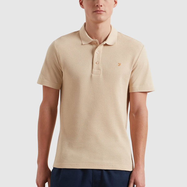 Man wears Farah Mens Forster Textured Panel Polo T-Shirt in Birch Cream
