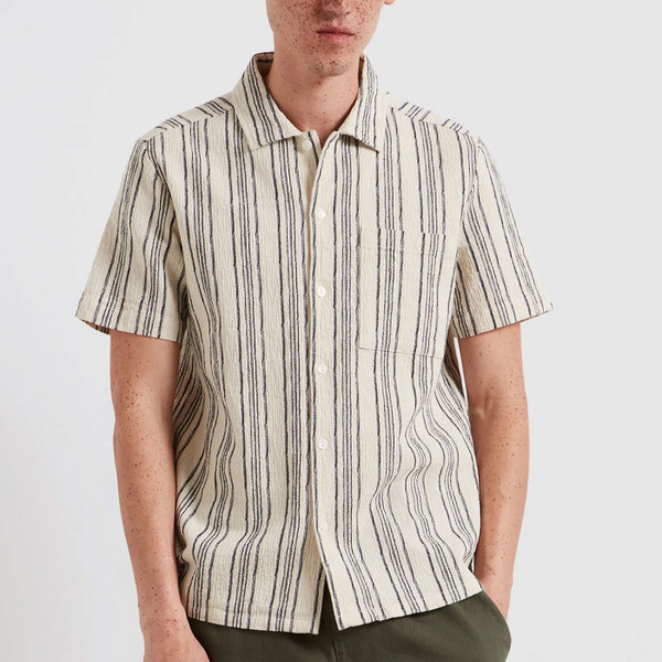 Man wears Farah Vintage Mens Simon Retro Fine Stripe Short Sleeve Dobby Shirt in Ecru
