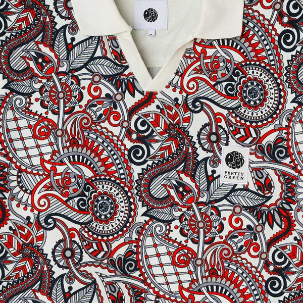 Model Wearing Pretty Green Resonance Men's Retro Paisley Printed Polo Shirt in White and Red Fabric Paisley Print View