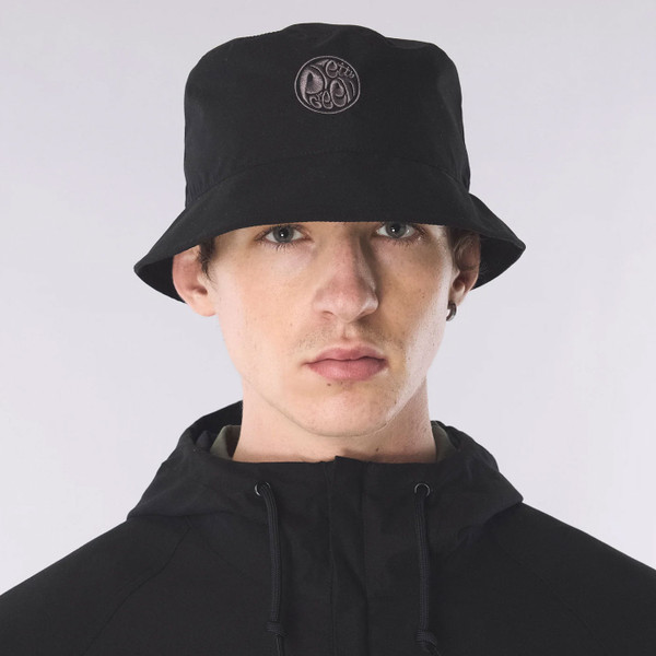 Man wears Pretty Green Resonance Water Reactive Paisley Bucket Hat in Black