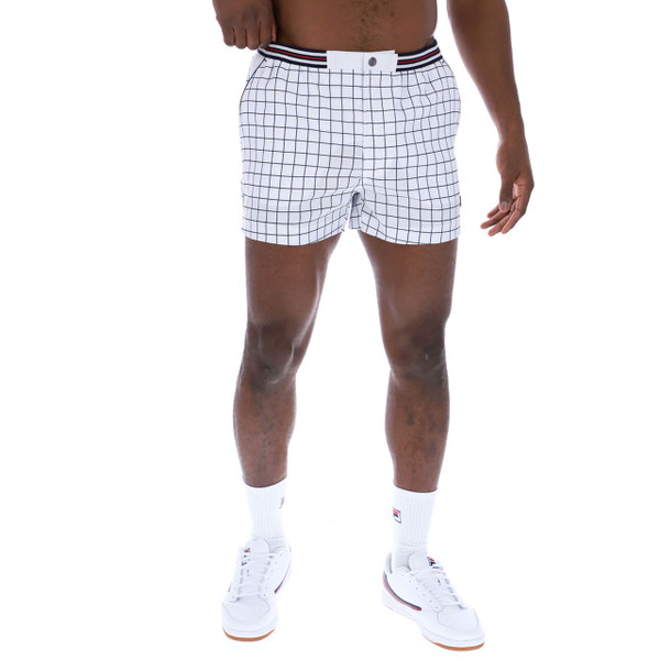 Man wears Fila Vintage Men's 70s 80s High Tide Check Tennis Shorts in White