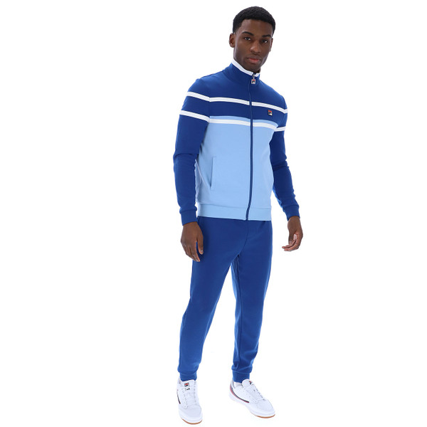 Man wears Fila Vintage Giovanni Men's Retro 80s Track Top Jacket in Frozen Fjord/Limoges Blue