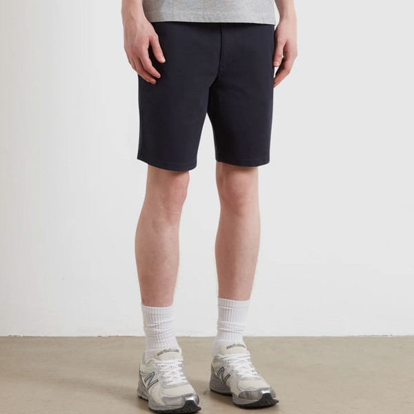 Man wearing Farah Vintage Mens Hawk Retro 50s Twill Chino Zip Fly Shorts in Navy
