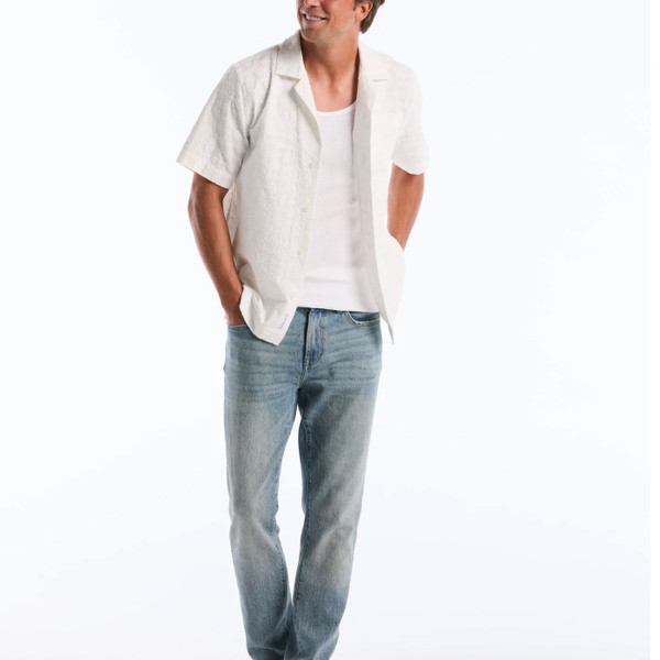 Model wears Original Penguin Mens Geo Embroidered Short Sleeve Cuban Shirt in Bright White