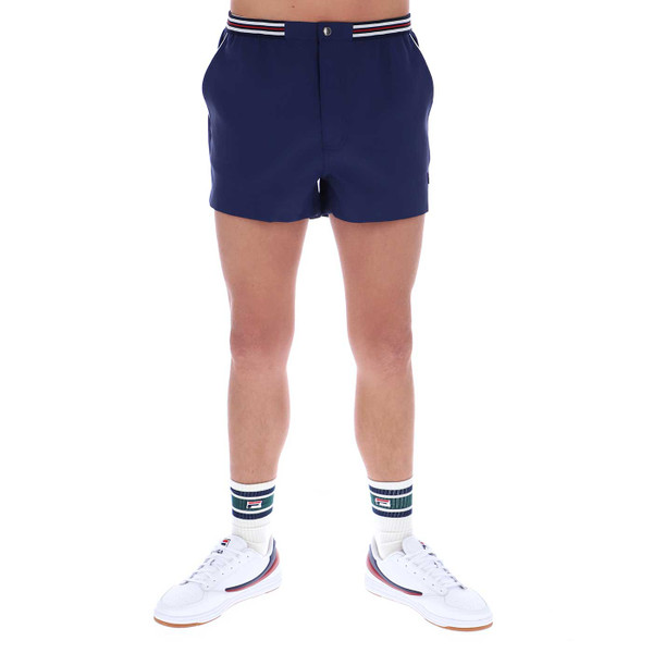 Man wearing Fila Vintage Hightide 4 Mens Retro 70s 80s Tennis Shorts in Navy