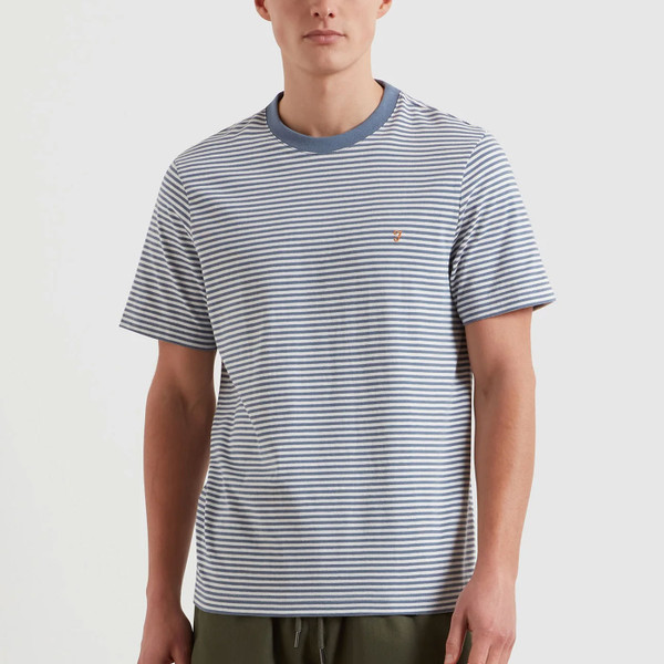 Man wears Farah Vintage Mens Castle Breton Stripe Crew Neck T-shirt in Blue Tide