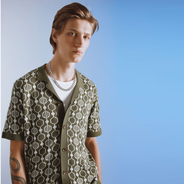 Man wearing Ben Sherman Geo Jacquard Retro 70s Knitted Button Through Shirt in Green