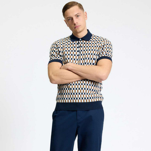 Model with Arms Folded Wearing Ben Sherman Mod Ska Jacquard Chequerboard Knit Polo Shirt in Dark Navy