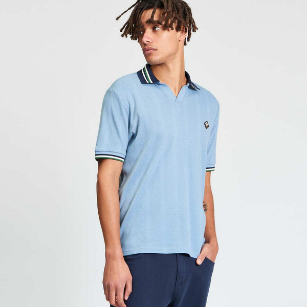 Model Wearing Ben Sherman Men's Retro Textured Contrast Collar Skipper Neck Polo Shirt in Denim Blue - Side View
