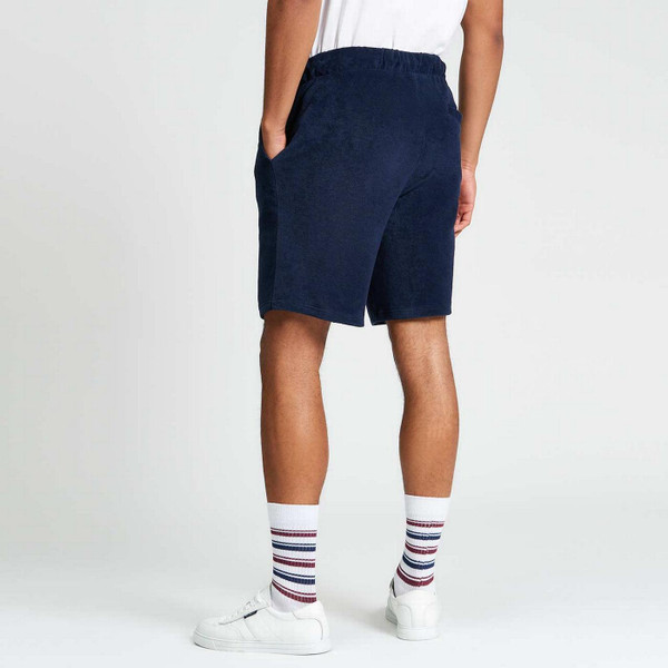 Model Wearing Ben Sherman Men's Retro 80s Towelling Shorts in Dark Navy Back View
