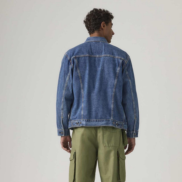 Model Wearing Levi's Type 3 Relaxed Denim Trucker Jacket in Million Dollar Blue Stonewash Back View