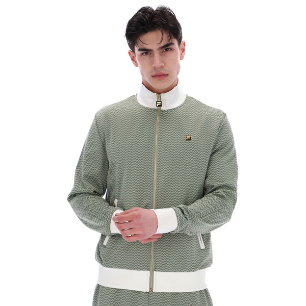 Model wears Fila Gold Mathers Men's Herringbone Retro Smart Track Top in Sea Foam Green