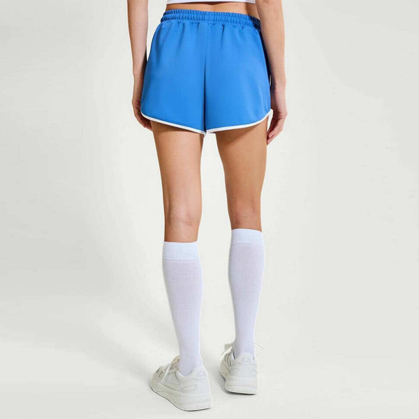 Model Wearing Ellesse Purden Women's Retro 80s Running Shorts in Blue and White - Back View