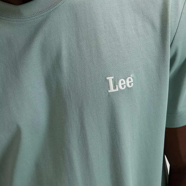 Model Wearing Lee Jeans Men's Retro Small Logo Short Sleeve Crew Neck T-shirt in Desert Sage - Embroidered Logo