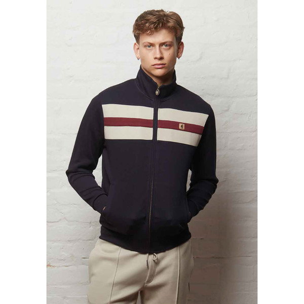 Man wearing Gabicci Vintage Escher Men's Retro Funnel Neck Chest Stripe Track Top in Navy