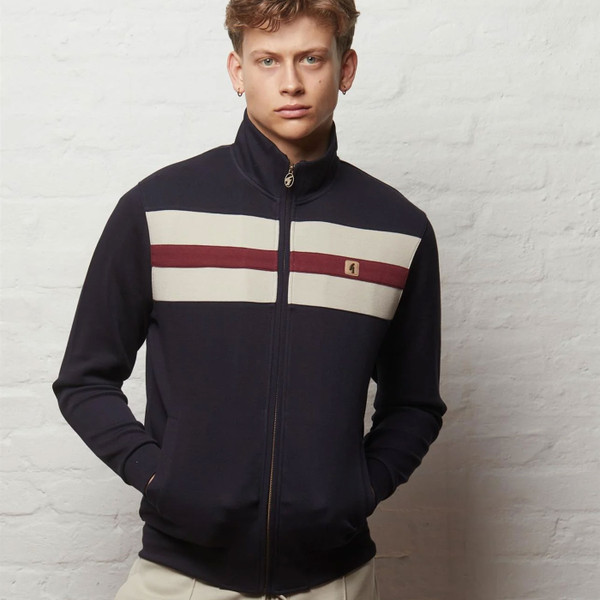 Man wearing Gabicci Vintage Escher Men's Retro Funnel Neck Chest Stripe Track Top in Navy