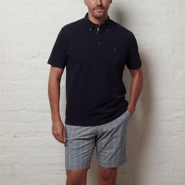 Man wearing Gabicci Vintage Murphy Men's Retro Prince of Wales Check Shorts in Delft