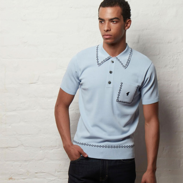 Man wearing Gabicci Vintage Alexander Men's Mod Archive Knitted Polo Shirt in Surf Blue