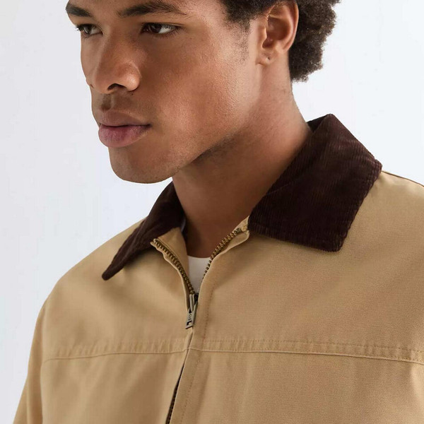 Model Wearing Wrangler Men's Retro Transitional Cord Collar Canvas Jacket in Golden Wheat - Collar Detail