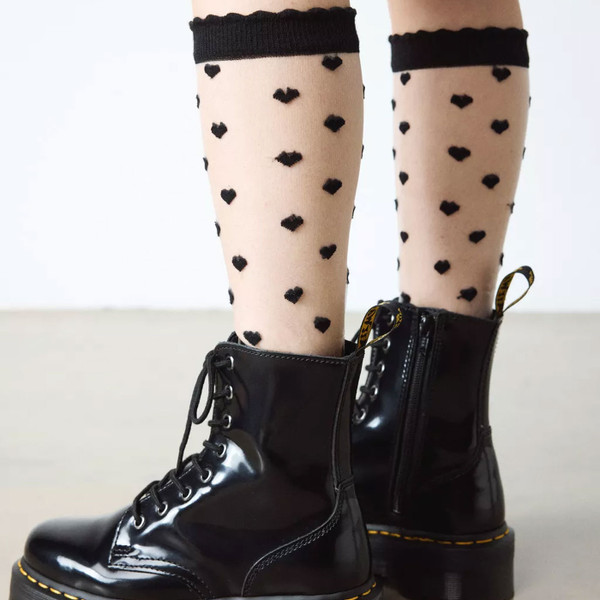 Woman wearing Dr Martens Womens Short Heart Mesh Sheer Retro Socks in Black/White