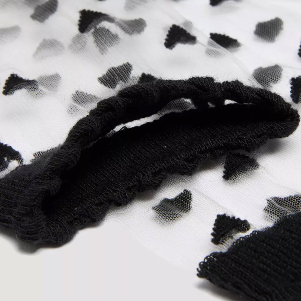 Top and heart motif on Dr Martens Womens Short Heart Mesh Sheer Retro Socks in Black/White