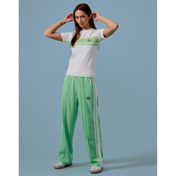 Woman wearing Sergio Tacchini Miss Masters Retro Track Pants in Quiet Green
