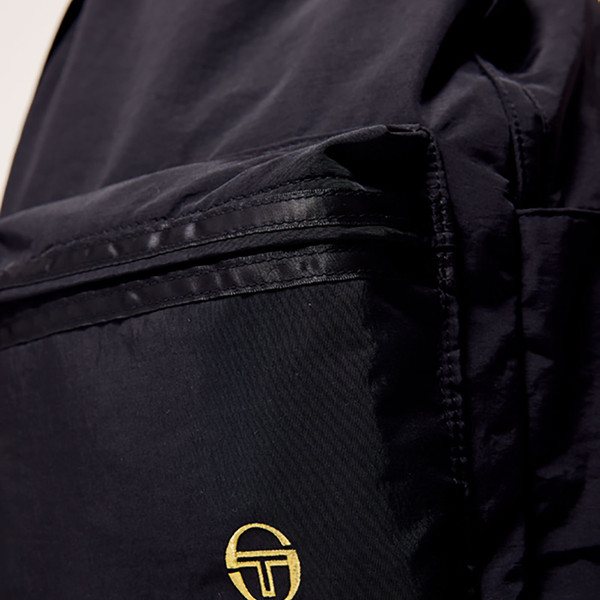 Pocket close up on Sergio Tacchini Geo Men's Retro Backpack in Black